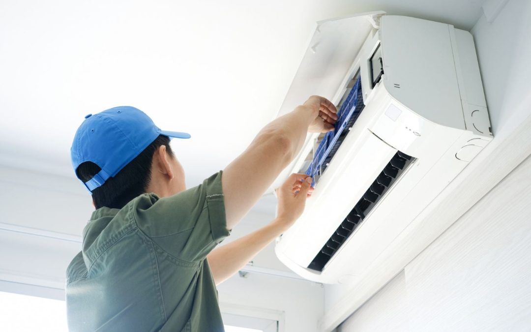 HVAC technician servicing a ductless mini split in Torrance