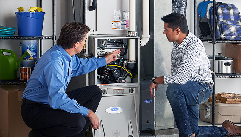 Technician evaluating a furnace for repair or replacement in Torrance