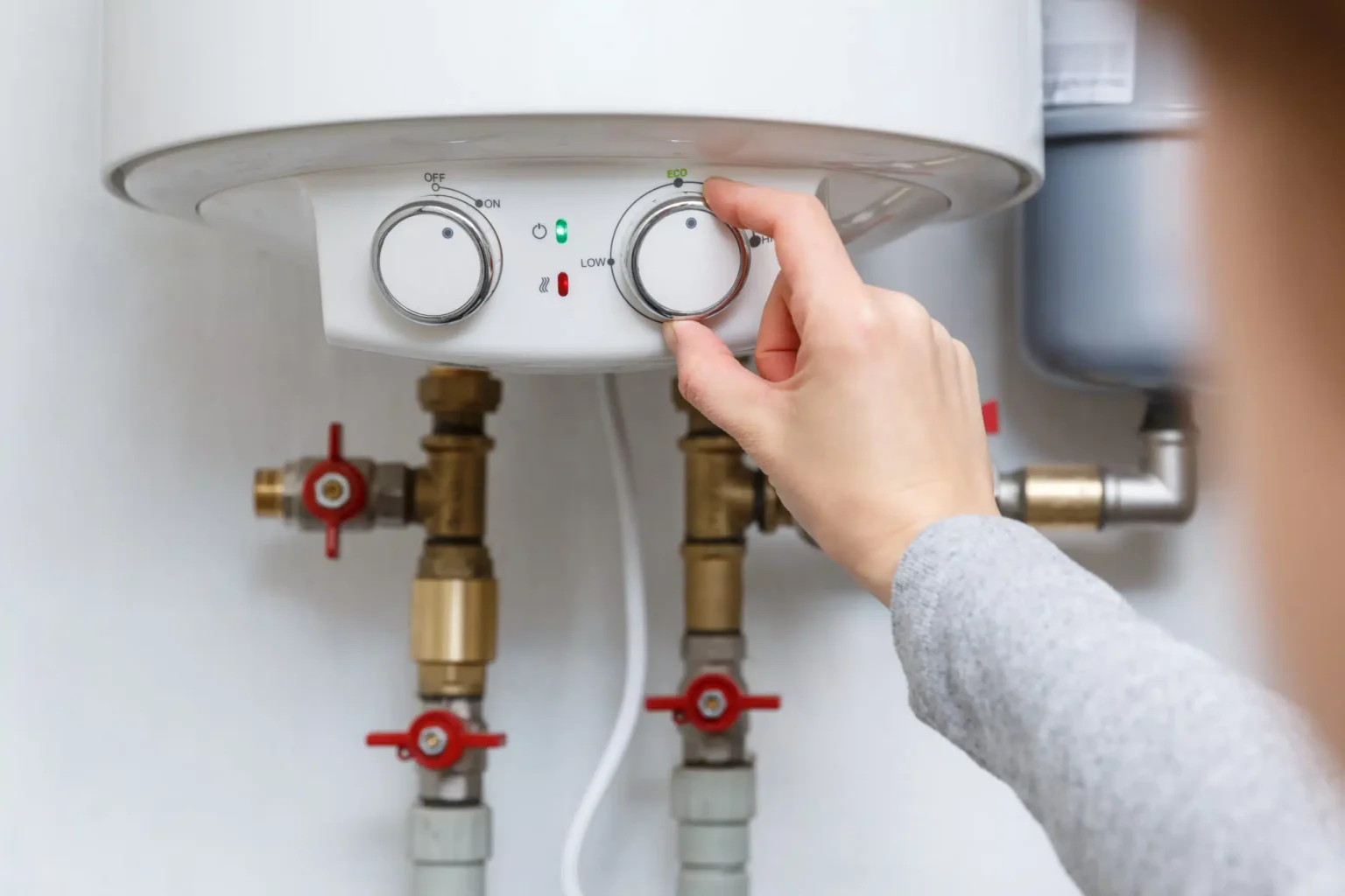 Technician adjusting a water heater in Torrance